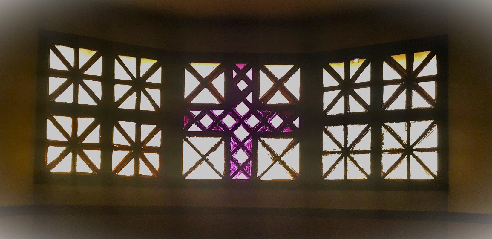 Stained glass windows showing the cross.