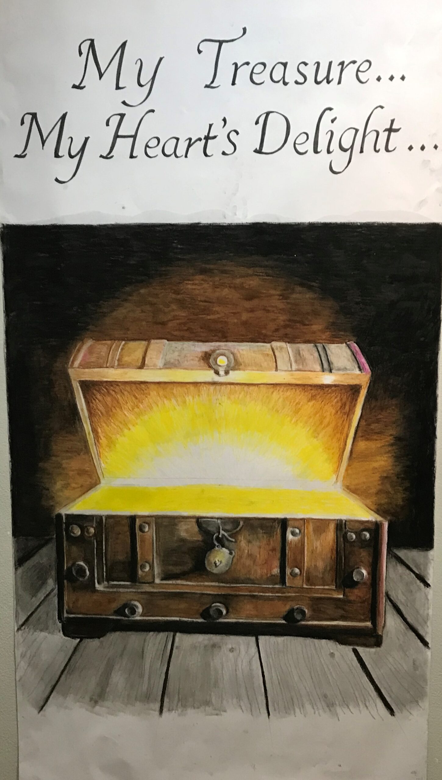 An open chest with a treasure within over which is a caption saying, "My treasure, my heart's delight."
