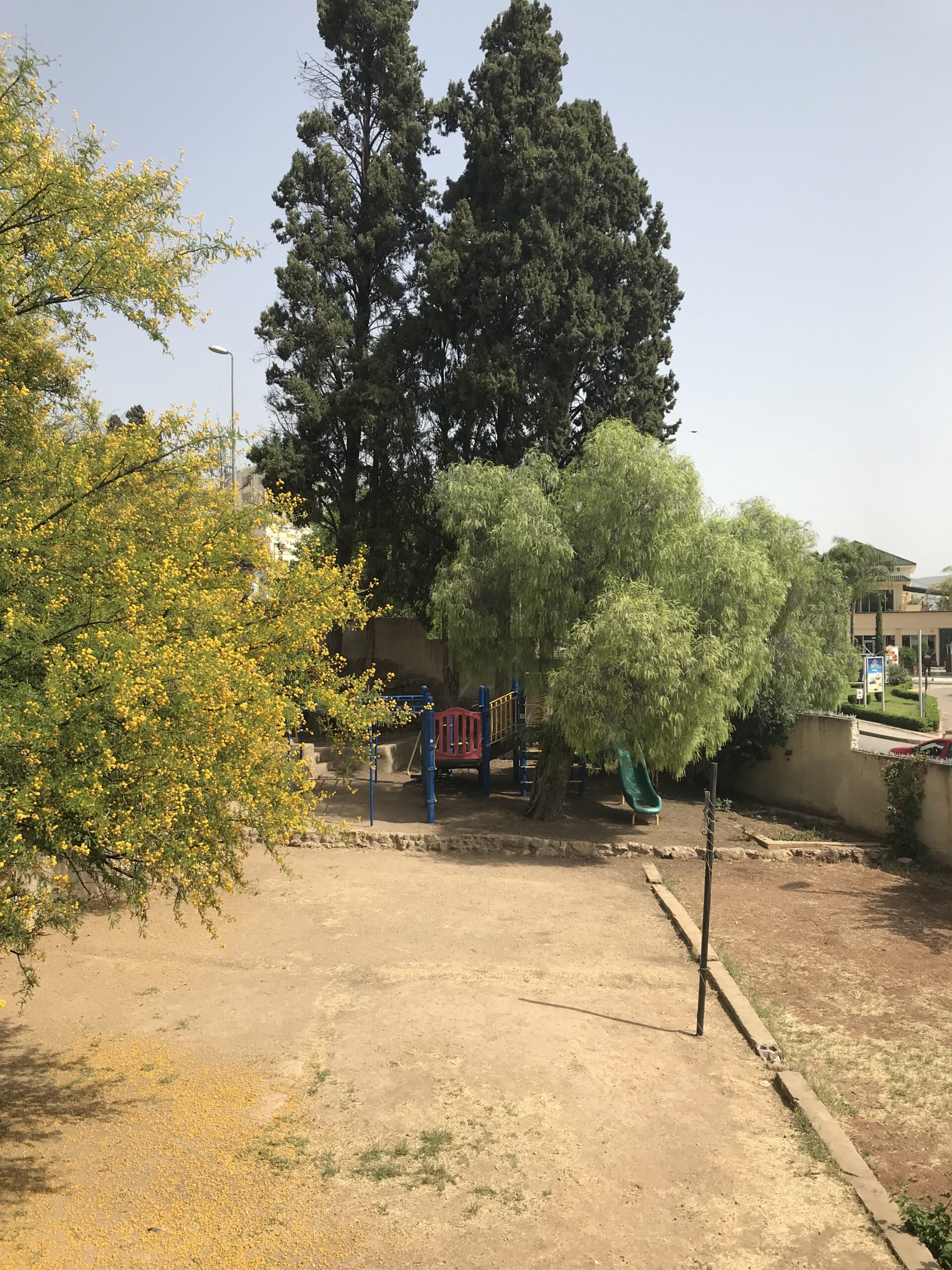 The yard behind the church showing the playground.